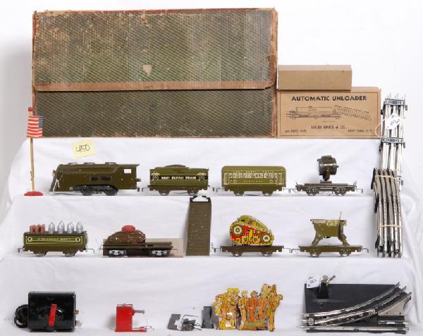 Marx unnumbered military set with tougher pcs.: Prewar Marx O gauge unnumbered military set in original box. Set is composed of Commodore Vanderbilt one tone drab green steam 0-4-0 locomotive with 952 wedge-type Army Supply Train tender two tone dr