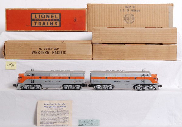 Lionel No. 2345 Western Pacific F3 diesels in MC: Postwar Lionel O gauge No. 2345 Western Pacific F3 diesel A units in master carton with inner boxes, instructions sheet and an inspection slip. Locos look fantastic, clean and shiny. Dummy looks C7+, 