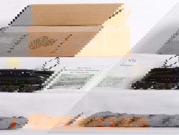 Lionel No. 2330 Pennsylvania GG-1 in OB: Postwar Lionel O gauge No. 2330 Pennsylvania 5 stripe GG-1 electric locomotive in original box with insert, instructions sheet, inspections slip and small tube of lubricant. Train looks amazing C7-8 w