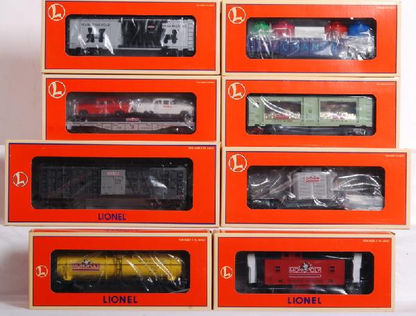 Lot of 8 Lionel Monopoly cars: Lot of eight Lionel Monopoly freight cars in OBs. Cars include 52160 Water Works tank car, 52159 Electric Co. transformer car, 52158 Luxury tank mint car, 52184 free parking flatcar, 52183 go to jail