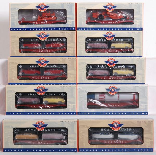 10 Lionel PWC freight cars 6414, 6407, 6816, etc.: Lot of 10 Lionel Postwar Celebration freight cars in OBs. Cars include three 29439 evans auto loaders, 29463 evans auto loader, two 19427 flat car with auto loader, 26024 flat with scraper, 26023 flat