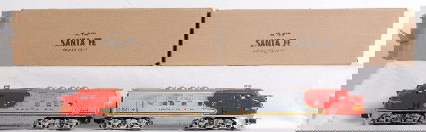 Lionel 2343 Santa Fe F3 diesel A units: Postwar Lionel O gauge No. 2343 Santa Fe twin diesel F3a units with screened roof vents, repro porthole lens and very clean battery compartment. Trains look very clean C6. Nice clean and crisp repro b