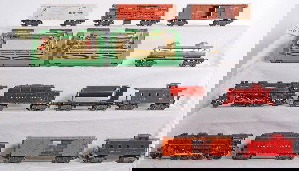 Instant postwar Lionel layout with trains and acce: Postwar Lionel O gauge trains, track and switches and other accessories, some are operating and some are stationary. Lot includes but is not limited to: 2026 steam loco, 6466T tender with whistle, 202