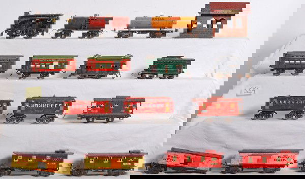 Large lot of prewar Dorfan, American Flyer, Lionel: Large lot of prewar O gauge electric and steam trains, freight and passenger cars and a station. J. Chein Grove station, tinplate building. Base measures approximately 5 1/2 inches long, 4 1/4 inches