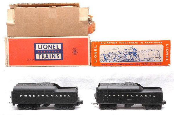 Lionel 736W and 2671W Tenders LN Boxed: Lionel postwar 736W Pennsylvania tender in worn OB missing flaps and 2671W Pennsylvania tender in OB with original cardboard insert and original wrap. The roller brackets on the 736W have surface rust
