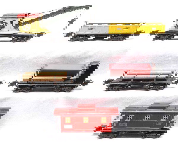 Lionel Prewar 3651 3652 3659 2660 2657: Lionel prewar O gauge freight cars; 3651 operating lumber car, 3652 operating gondola, 3659 operating dump car, 2660 crane and 2657 caboose. The 3659, 2660 and 2657 are partially restored. The other t