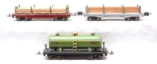 Lionel Prewar Freight Cars 811 811 815: Lionel prewar O gauge freight cars: 811 flatcar with wood load, nickel trim and journals, 811 maroon flatcar with wood load and a 815 pea green tank, both with brass trim and nickel journals. The maro