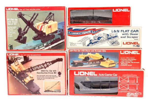 Lionel 2-9121 9122 9123 9157 9158 LN OBs: Lionel freight cars; two 9121 L & N flatcars with dozer and scraper kits, 9122 NP flatcar with vans, 9123 auto carrier car, 9157 C & O flatcar with construction crane kit and a 9158 PC flatcar with st
