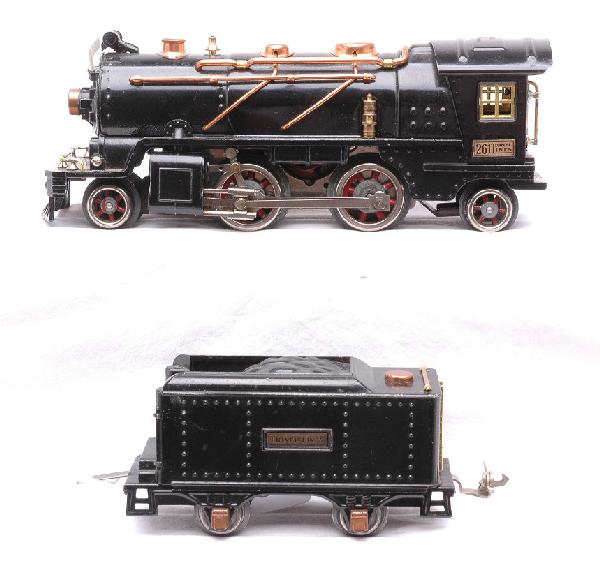 Lionel Prewar 261 Black Steam Loco 257T Tender: Lionel prewar O gauge 261 black 2-4-2 steam loco with a 257T tender. The loco and tender have brass and copper trim. The loco is missing one flag. Loco and tender are C7.