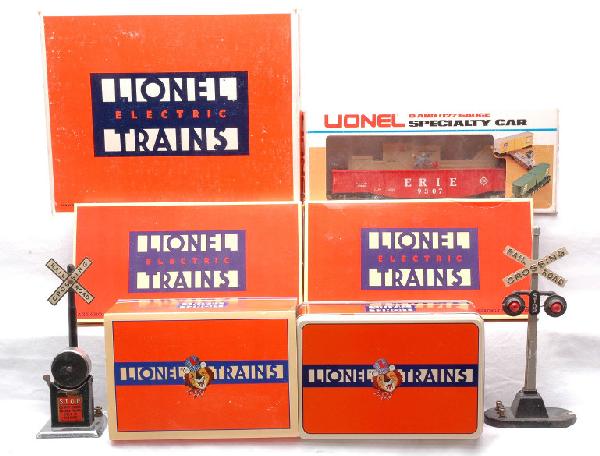 Lionel 9307 19800 2-5530 LN OBs Hand Car MIB: Lionel 154 highway signal, 9307 animated Erie gondola, 19800 operating cattle car with corral, missing the car and two 5530 O gauge operating track sections all in OBs. The 154 is C5, 9307 is C8, the 