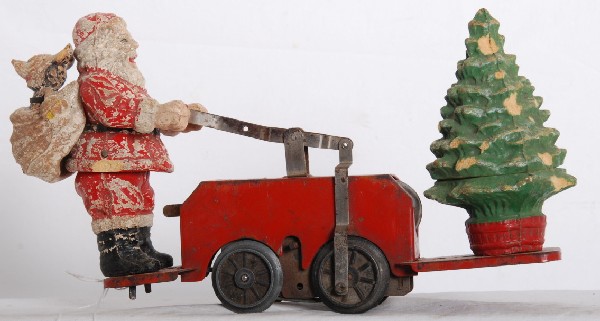 Lionel No. 1105 Mickey Mouse Santa car: Prewar O gauge Lionel No. 1105 hand car with Santa Claus with Mickey Mouse in sack with red base, chips and typical hairlines, C5 area.