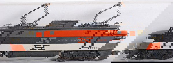 Rare Lionel 2350 New Haven EP-5 electric loco: Postwar O gauge Lionel No. 2350 New Haven EP-5 electric locomotive with rare reverse color and painted nose variations. Cracks at both noses and one is missing the headlight lens. Loco looks C5-6.