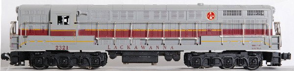 Lionel No. 2321 Lackawanna FM Trainmaster, gray: Postwar O gauge Lionel No. 2321 Lackawanna Fairbanks Morse Trainmaster diesel locomotive with gray top and typical screw cracks, C8 with clean battery compartment.