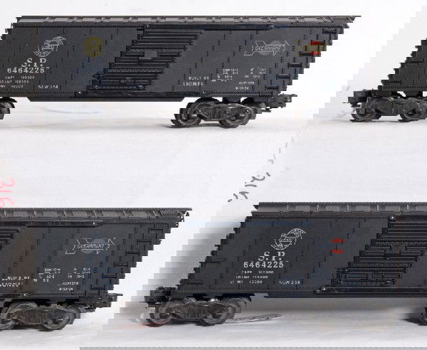Two Lionel 6464-225 SP boxcars: Two Lionel postwar 6464-225 Southern Pacific boxcars, type IIa bodies. One is C7+ with very slight rust spots on trucks. The other is a curiosity piece with all white lettering where it should normall