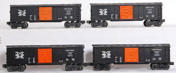 Four Lionel 6464-425 New Haven boxcars: Four Lionel postwar 6464-425 New Haven boxcars. Type IIb full serif N. Type type III full serif N. Type IIb full serif N. Type IIb half serif N. C7 area on all four