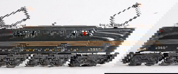 Great Lionel No. 2360 PRR GG-1 green, 5-stripe: Postwar O gauge Lionel No. 2360 green Pennsylvania GG-1 electric locomotive with great looking stripes on one side and slightly lighter stripes on other. Stripes are full. Loco has some minor touchups