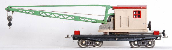 Lionel S.G. No. 219 derrick, ivory cab, green boo: Prewar Lionel standard gauge No. 219 operating derrick with ivory cab, red roof and tool boxes, nickel trim and a green boom. Tool boxes have touchups and cab is missing two handrails and stanchions. 