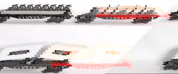 Lionel No. 3460, 6262 and 6264 flatcars w/loads: Postwar O gauge Lionel No. 3460 flatcar with lumber load and three extra timbers, No. 6262 wheel car with unrun load and 6264 flatcar with Cooper Jarrett trailers. Flatcars are unrun and should clean