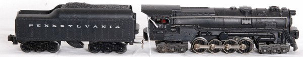 Lionel Postwar 671 Turbine with 2671W: Lionel Postwar O Gauge 671 turbine, Lionel Atomic Motor version with smoke bulb C6. Tender is white letter 2671W PRR one repaired corner C6.