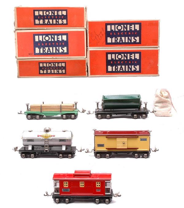 Lionel Freight Cars 651 654 655 659 657 LN OBs: Lionel prewar O gauge freight cars; 651 45N green lumber car with wood load, 654 aluminum Sunoco tank, 655 cream boxcar with maroon roof, 659 medium green dump car with a no. 207 bag of coal and a 657
