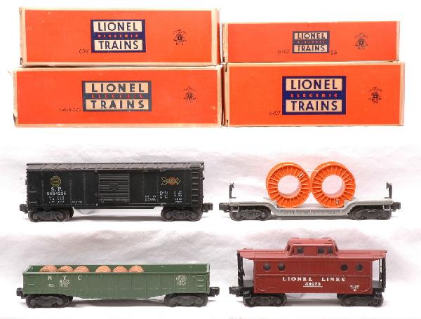 Lionel Freights 6464-25 6464-225 6561 6427 OBs: Lionel postwar freight cars from the 1517W Texas Special freight set, circa 1954; 6464-25 green New York Central gondola with six wooden barrels, 6464-225 Southern Pacific boxcar, 6561 cable car with