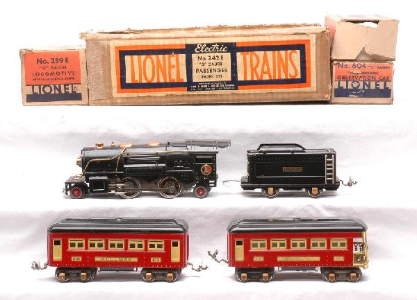 Lionel Prewar Red Passenger Set no. 242E: Lionel prewar O gauge passenger set no. 242E in set box containing; 259E black 2-4-2 loco with 259T tender, 603 Pullman and 604 observation. The loco has copper and brass trim, the tender has brass an