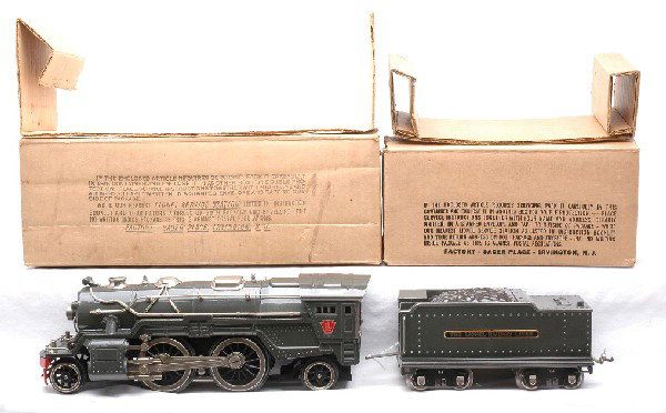 Lionel Gunmetal 385E Loco 385W Tender OBs: Lionel prewar standard gauge 385E gunmetal 2-4-2 steam loco and a 385W gunmetal whistle tender both in OBs with original cardboard inserts. The loco and tender have nickel trim. The paint and trim on 