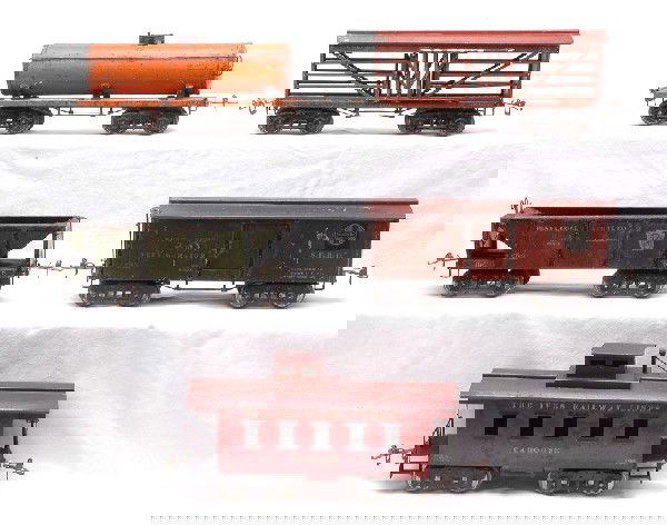 Ives Wide Gauge Freight Cars 190 192 193 194 195: Ives wide gauge freight cars including; 190 medium orange Texas Oil tank with no air tanks, 192 red-brown S.F.R.D. merchandise car, 193 red-brown PRR stock car, 194 dark olive green Penna. Coal & Coke