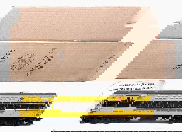 Lionel 2331 Black/Yellow Virginian FM MINT OB: Lionel postwar 2331 Virginia Trainmaster FM diesel in OB with original cardboard insert and instruction sheet. This is the version with gray body painted both black and yellow. Cab has two screw hole