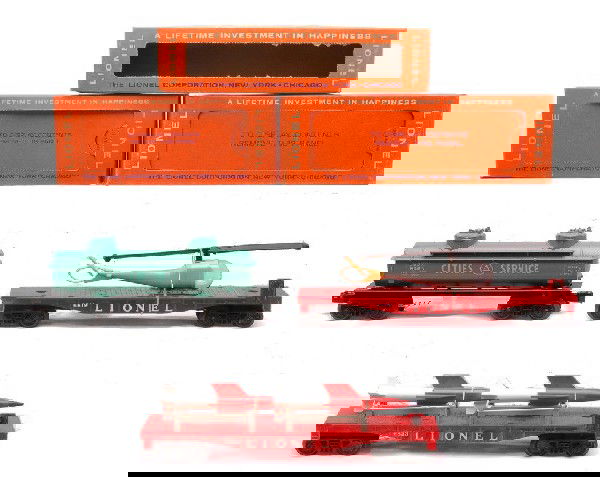 Lionel Freights 6819 6823 6465-110 MINT Boxed: Lionel postwar 6819 flatcar with helicopter, 6823 flatcar with missile and 6465-110 Cities Service tank car in OBs. All cars have never been run, C9-10. OBs have all flaps and display panels intact ex