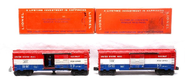 Lionel 3428 Operating 6428 Railway Mail Cars OBs: Lionel postwar 3428 operating United States Mail Railway Post Office Mail car with original mail bag and a 6428 United States Mail Railway Post Office Mail car in OBs. The axles on the 3428 have some 