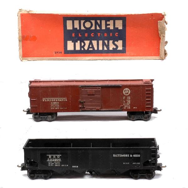 Lionel 2954 PRR Boxcar w/OB 2956 B&O Hopper: Lionel prewar semi scale 2954 Tuscan Pennsylvania boxcar in a worn OB and a 2956 black Baltimore & Ohio hopper. Both cars have black journals. The boxcar has paint touch up and is C6. The hopper is C7