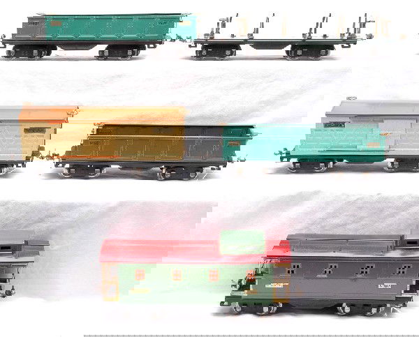 Lionel Freights 511 512 512 514 517: Lionel prewar standard gauge 500 series freight cars; 511 dark green flatcar missing the lumber load, two 512 peacock gondolas, 514 yellow boxcar with orange roof and a 517 green caboose with a red ro