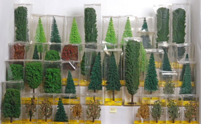 Aprox. 47 Noch G scale trees: Noch G Scale trees in OBs. Aprox 47 trees, includes multiple 6823 Pine, 6821 Tanne, 6812 Pappel, and 6805 Birch, and more. Trees are all C9-10 and OBs are in generally good condition. If shipped it wi