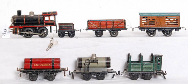 K.B.N. loco and tender w/five freight cars: Prewar O gauge Karl Bub K.B.N. steam locomotive and tender with Kraus gondola, Hornby flatcar with gas cylinders, unmarked stock car, unmarked tank car and unmarked stake sided gondola with dog house.