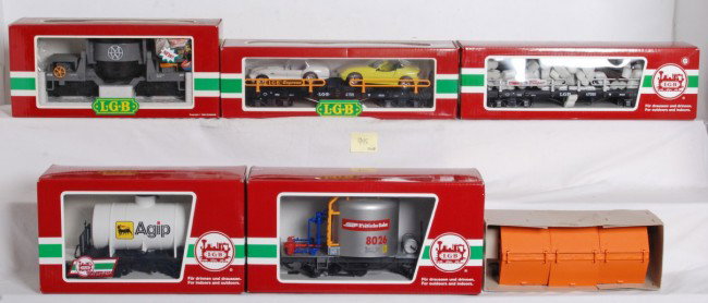 LGB freight cars 40560, 45253, 4159, Etc: LGB G Scale freight cars in OBs. Six cars include 4011 covered gondola, 4159 flat with two autos, 47590 flat with two autos, 94480 Agip tank car, 45253 RhB Cement silo, and 40560 operating ore dump ca