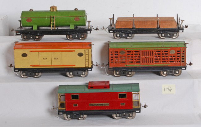 Lionel No. 211 w/lumber, 213, 214, 215 and 217: Prewar Lionel standard gauge freight cars No. 211 flatcar with lumber load, 213 stock car, 214 automobile furniture boxcar, 215 oil car and 217 caboose. Trains should clean and polish to look nicer C5