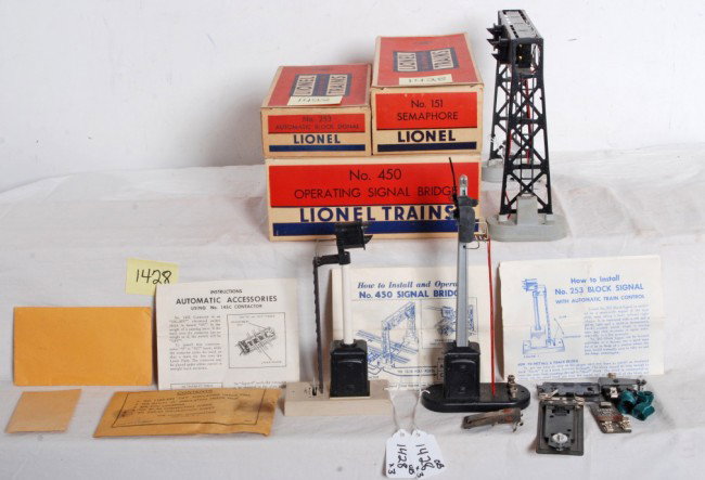Lionel postwar No. 151, 253, 450 accessories in O: Postwar Lionel O gauge operating accessories in original boxes with inserts, component envelopes, instructions sheets, etc. No. 151 semaphore with insert, instructions and 145C. No. 253 automatic bloc