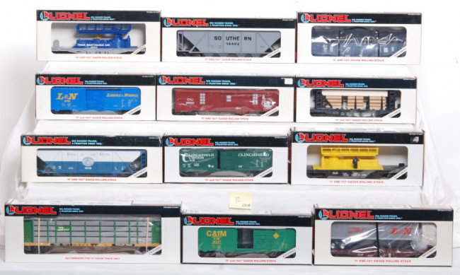 12 Lionel freight cars 16620, 16358, 19237, etc.: Lionel modern O Gauge freight cars in OBs. Twelve cars including 19237 Chicago and Illinois Midland boxcar, 16357 L&N flat with trailer, 16347 Ontario Northland flat with wood load, 16610 and 16620 tr