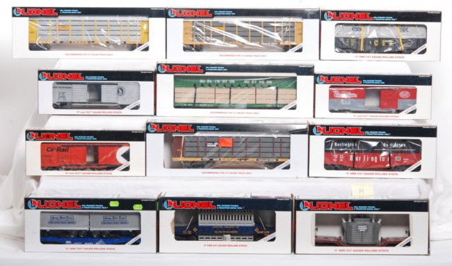 Lionel LTI auto racks, freight cars, 12 total: Lionel modern O Gauge freight cars in OBs. Twelve cars include 16215 Conrail, 16229 Erie, and 16228 Union Pacific auto racks. Other cars include 19240 Great Northern double door boxcar, 16236 New York
