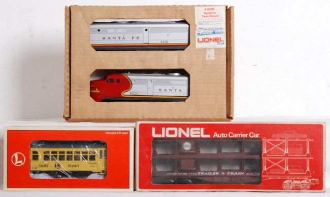 Lionel Santa Fe 8020, 18431 Trolley, 9123 auto: Lionel O gauge 8020 Santa Fe twin diesel set in OB. Locos are C7-8 with some scuffs. 18431 #60 trolley in OB. C8 with some run time and 9123 N&W auto carrier in OB. C7-8 with water stained box and pri