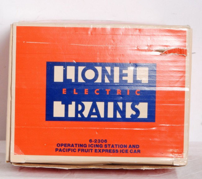Lionel 2306 Icing Station with PFE ice car: Lionel O Gauge modern 2306 Icing Station in OB with all instructions and Pacific Fruit Icing car. Station and car look C8. Missing ice blocks. OB shows some wear with a rip in one flay and creasing on