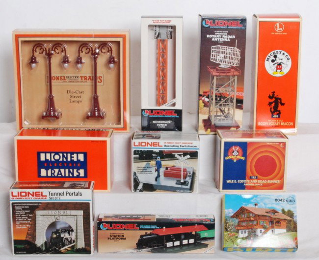9 Lionel acc. radar towers, pumping station, etc.: Lionel O Gauge modern accessories in OBs. Includes 12723 microwave tower, 12749 radar tower, 12965 Disney Goofy rotary beacon, 12955 Wile E. Coyote ambush shack, 2128 operating switchman, 2113 tunnel 