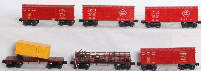 Lionel 1877, 6050, 6050, 638-2361, 638-2361: Postwar O gauge Lionel No. 1877 flatcar with fencing and horses, unnumbered flat w/trailer, two 6050 Swift reefers with coin slots, two 638-2361 Van CampÕs boxcars with coin slots. Trains look C6-7.