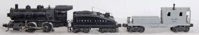 Lionel No. 1656 switcher w/6403B and 2419 caboose: Postwar Lionel O gauge No. 1656 steam type locomotive with No. 6403B tender with bell and 2419 Delaware, Lackawanna and Western work caboose (chipped tool chest), C6.