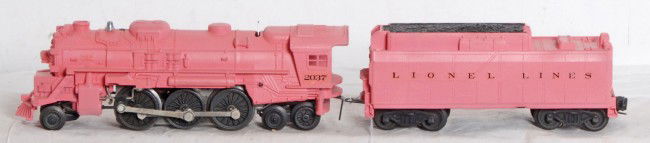 Postwar Lionel steam locomotive and 6026W Pink: Postwar Lionel O gauge steam type locomotive and 6026W tender with whistle painted in a pink paint with decal lettering and numbering. Train looks C7.
