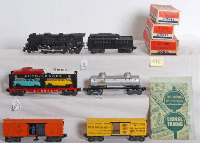 Lionel No. 2018, tender, 3464, 6656, 6465, 6414: Postwar Lionel O gauge No. 2018 loco, tender with repainted frame and missing rear steps, X3464 Santa Fe operating boxcar, 6656 stock car in OB, 6465 Sunoco tank in OB, 6414 Evans Auto-Loader car in O