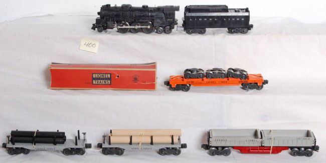 Lionel No. 2037, tender, 2411, 2411, 3359, 6362: Postwar Lionel O gauge No. 2037 loco, tender with whistle, two 2411 flatcars (three original pipes), 3359 twin bin dump car (red plastic covers are broken on one end) and a 6362 rail truck car with lo