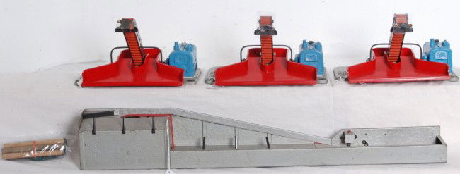 Three Lionel postwar No. 397 and one 364: Postwar Lionel O gauge accessories, three No. 397 coal loaders with repaired, broken or repro shields, 364 lumber loader, two No. 364C control switches (one is missing a piece of case) and a wire coil