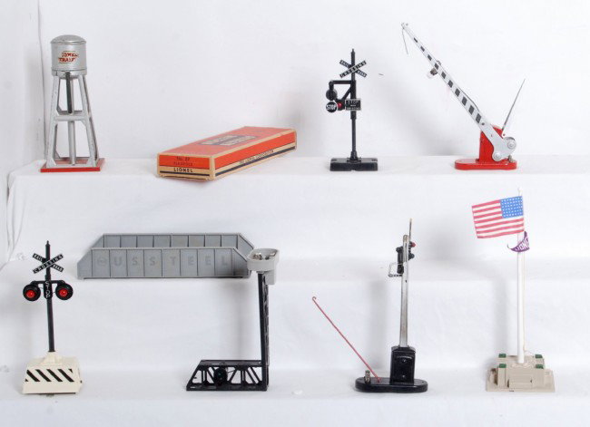 Lionel operating accessories, 151, 452, 140, 93, 15: Postwar O gauge Lionel operating accessories, 151 semaphore, 452 cantilever signal, 140 banjo signal, 93 water tower, 152 crossing gate, 89 flagpole in OB, 2214 bridge, and more C7-9. OB is C8+.